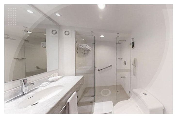 Fotografía de una habitación de Lagomar hotel y centro de convenciones, que muestra tres camas sencillas