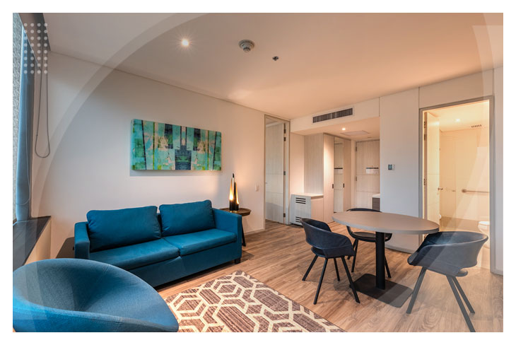 Fotografía de una habitación de Lagomar hotel y centro de convenciones, que muestra tres camas sencillas